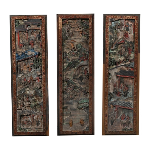 655 - A SET OF TWELVE CHINESE CARVED PAINTED PANELSQIANLONG, 1736-1795each panel approximately 142cm high,... 