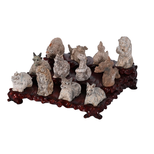 680 - TWELVE CHINESE POTTERY MODELS OF THE ZODIAC ANIMALS LATE 20TH CENTURYDepicting a rat, ox, tiger, rab... 