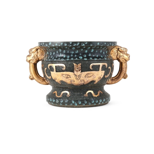 689 - A CHINESE GLAZED BRONZE TWO-HANDLED ARCHAISTIC STYLE PLANTER 20TH CENTURYGlazed in tones of green wi... 