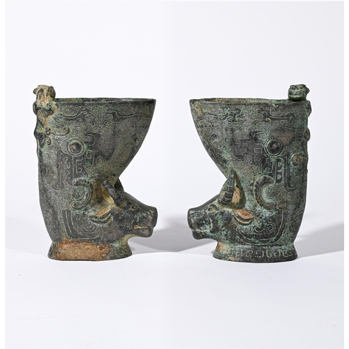 690 - A PAIR OF CHINESE ARCHAISTIC MODELS OF RHINOS20TH CENTURYInlaid with wire, hinged covers to backs fo... 