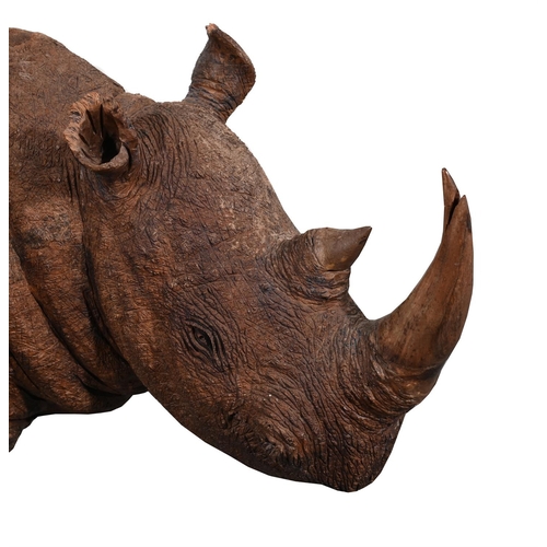 701 - A CARVED WOODEN SCULPTURE OF A RHINO43cm high, 91cm long, 33cm wideProvenance:Private Collection