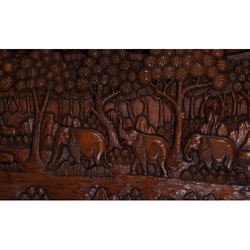 702 - A HIGH RELIEF CARVED WOOD PANEL OF ANIMALS IN A JUNGLE20TH CENTURY approximately 61cm high, 120.5cm ... 