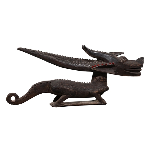 709 - A LARGE PAIR OF CARVED WOODEN DRAGONS20TH CENTURY approximately 64cm high, 148cm long, 28cm wide, th... 