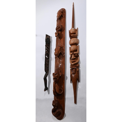 720 - A GROUP OF THREE CARVED WOOD WALL HANGINGSCONTEMPORARYthe tallest with frogs and snakes approximatel... 