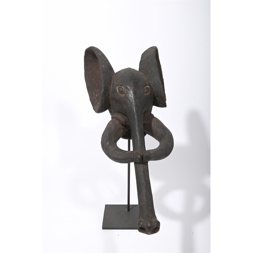 721 - A CARVED WOOD BABANKI ELEPHANT MASKCAMEROON, 20TH CENTURYapproximately 80cm high including standTOGE... 