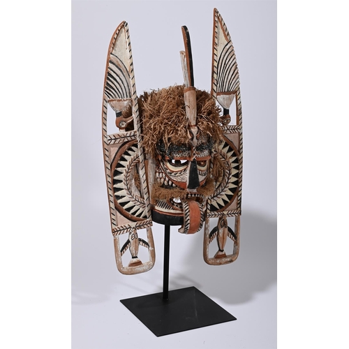 726 - A GROUP OF THREE LARGE TRIBAL MASKS 20TH CENTURY One freestanding and carved wood approximately 105c... 