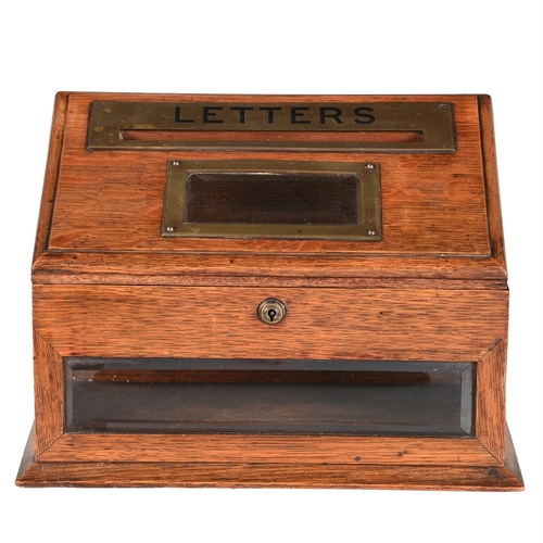 762 - AN EDWARDIAN OAK AND BRASS MOUNTED LETTER BOXBY J.C. VICKERY, CIRCA 1905With a maker's plaque for 'J... 