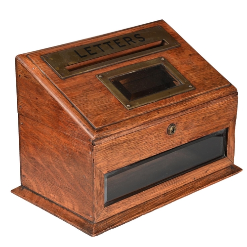 762 - AN EDWARDIAN OAK AND BRASS MOUNTED LETTER BOXBY J.C. VICKERY, CIRCA 1905With a maker's plaque for 'J... 