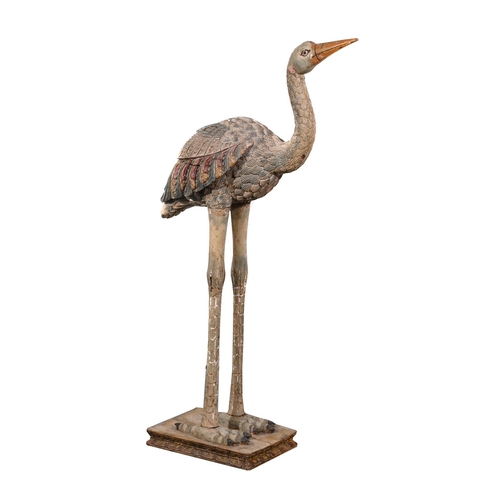 816 - A CARVED AND POLYCHROME PAINTED MODEL OF A STORK LATE 19TH OR EARLY 20TH CENTURYModelled stood atop ... 