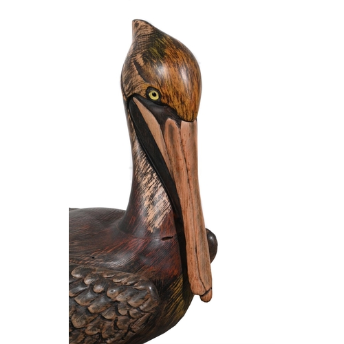 828 - TOM TABER, A PAINTED WOOD MODEL OF A PELICAN AND A GOOSELATE 20TH CENTURY the pelican, signed to the... 