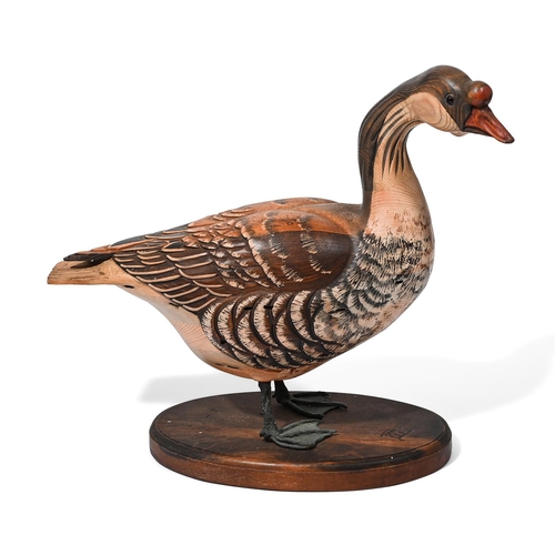 828 - TOM TABER, A PAINTED WOOD MODEL OF A PELICAN AND A GOOSELATE 20TH CENTURY the pelican, signed to the... 