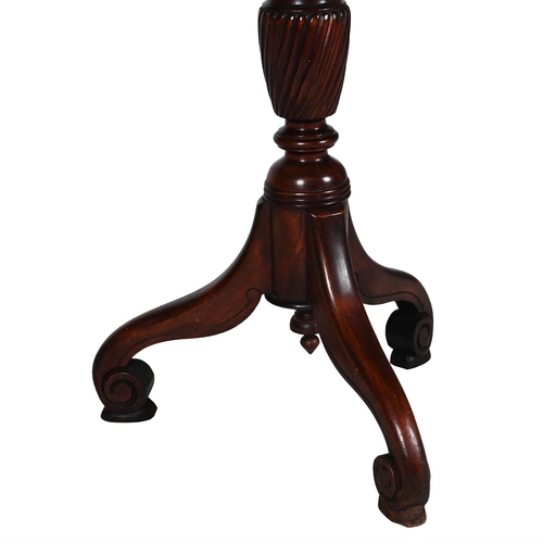 104 - A MAHOGANY TORCHERE STAND 19TH CENTURYWith carved, turned, and wrythen stem above tripod base137cm h... 