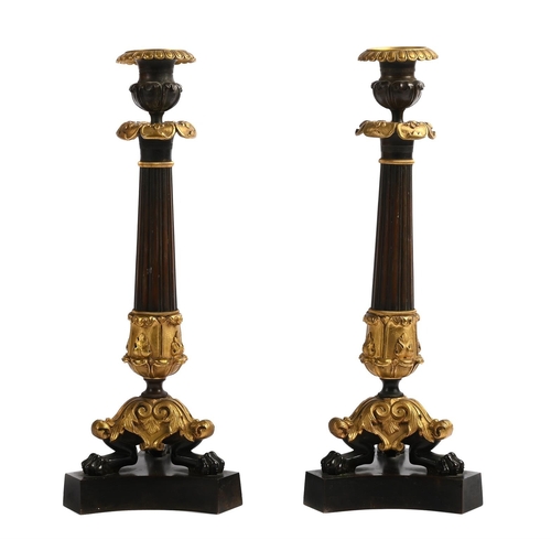 117 - A PAIR OF ORMOLU AND PATINATED BRONZE CANDLESTICKS FRENCH 19TH CENTURY Herculaneum style bases 36cm ... 