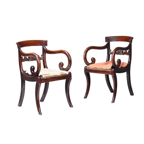 123 - A PAIR OF REGENCY MAHOGANY ARMCHAIRSCIRCA 1820Each with a bar back above carved horizontal splat, op... 