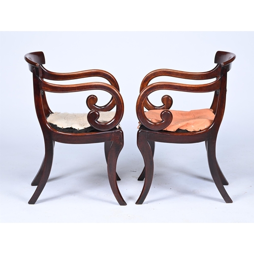 123 - A PAIR OF REGENCY MAHOGANY ARMCHAIRSCIRCA 1820Each with a bar back above carved horizontal splat, op... 