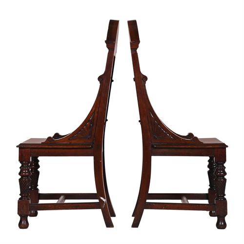 127 - A PAIR OF VICTORIAN CARVED MAHOGANY HALL CHAIRSLATE 19TH CENTURY111cm high, 54cm wide, 51cm deep