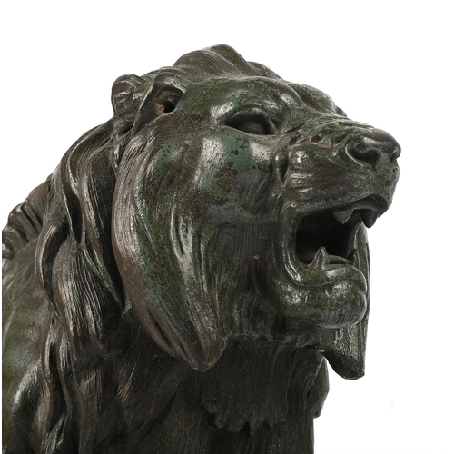 148 - AFTER BARYE, A BRONZED SPELTER LION EARLY 20TH CENTURY Set on marble base, signed to cast 47cm long ... 