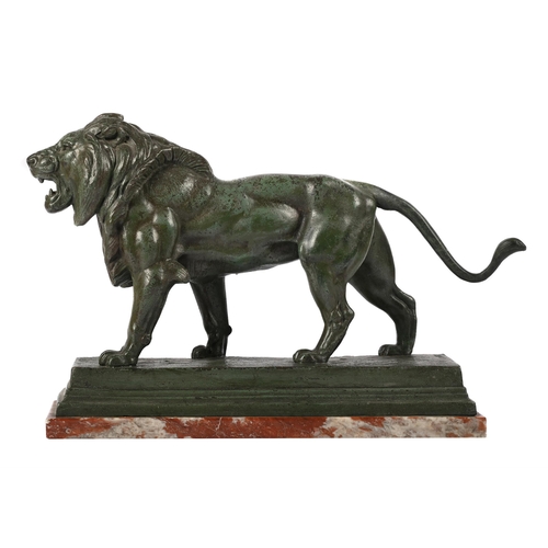 148 - AFTER BARYE, A BRONZED SPELTER LION EARLY 20TH CENTURY Set on marble base, signed to cast 47cm long ... 