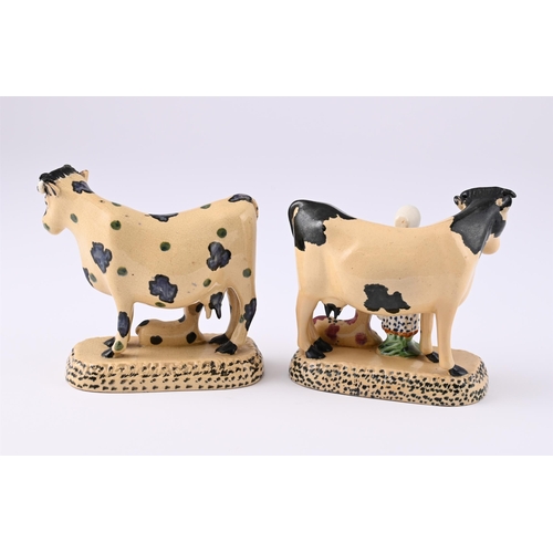 162 - TWO BUFF-COLOURED POTTERY COW AND CALF GROUPS OF YORKSHIRE TYPECIRCA 1820One modelled with a milkmai... 