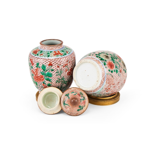 173 - A PAIR OF CHINESE WUCAI SMALL JARS AND COVERS20TH CENTURYWith ormolu mounts, each decorated in green... 