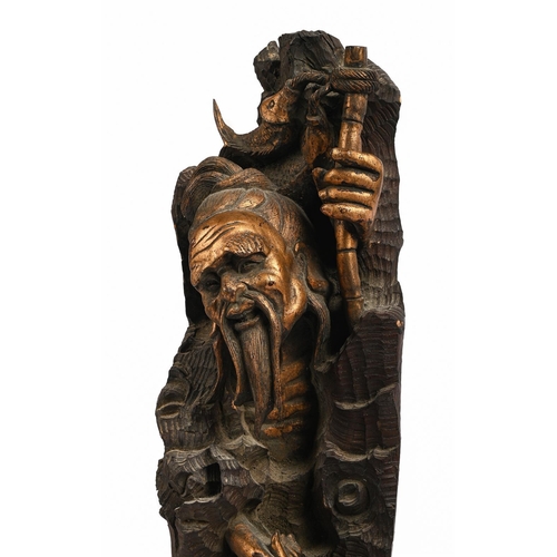 178 - A WOODEN CARVED JAPANESE FISHERMAN20TH CENTURY68cm high, 22cm diameter