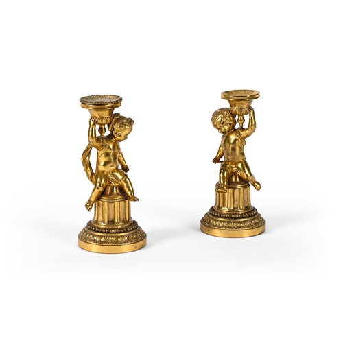 186 - A PAIR OF ORMOLU FIGURAL CANDLESTICKS PROBABLY FRENCH, EARLY 20TH CENTURY Each with single seated ch... 