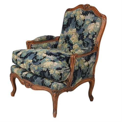 25 - A BEECH AND VERDURE TAPESTRY UPHOLSTERED FAUTEUILIN LOUIS XV STYLE, 20TH CENTURYRecently re-upholste... 