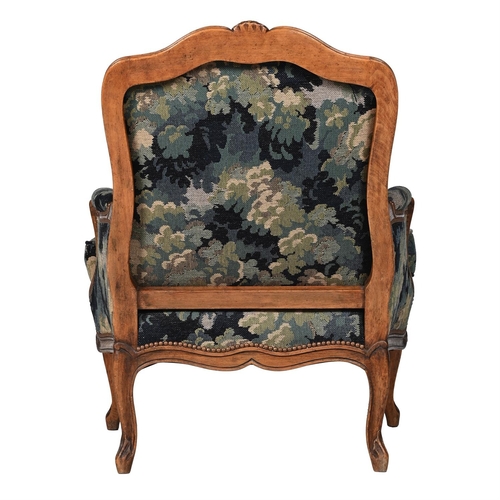 25 - A BEECH AND VERDURE TAPESTRY UPHOLSTERED FAUTEUILIN LOUIS XV STYLE, 20TH CENTURYRecently re-upholste... 