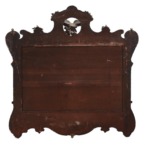 31 - A LARGE MAHOGANY AND PARCEL GILT MIRRORIN GEORGE II STYLE, 19TH CENTURYmirror plate approximately 61... 