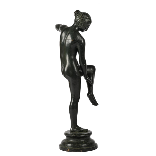 37 - AFTER THE ANTIQUE, APHRODITE UNTYING HER SANDALLATE 20TH CENTURYpatinated metal66cm high, 19cm diame... 