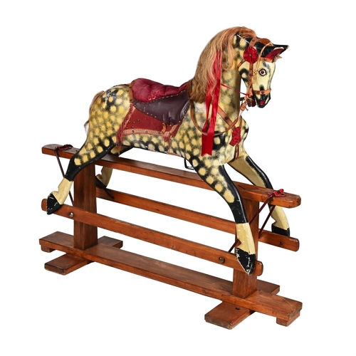 394 - A POLYCHROME PAINTED CARVED WOOD ROCKING HORSEBY COLLINSON, LIVERPOOL, FIRST HALF 20TH CENTURY128cm ... 