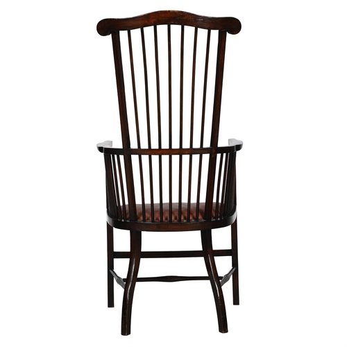 40 - AN ARTS AND CRAFTS MAHOGANY ARMCHAIRBY LIBERTY & CO., 20TH CENTURY With spindle supports, a replaced... 