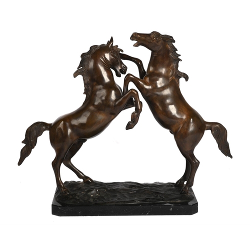 55 - AFTER COUSTOU, AN ANIMALIER BRONZE OF REARING HORSES 20TH CENTURY Signed indistinctly possibly De Sa... 