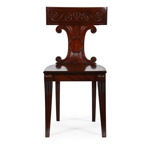 64 - A REGENCY MAHOGANY HALL CHAIR IN THE MANNER OF THOMAS HOPE, CIRCA 1820The bar back above scrolled sh... 