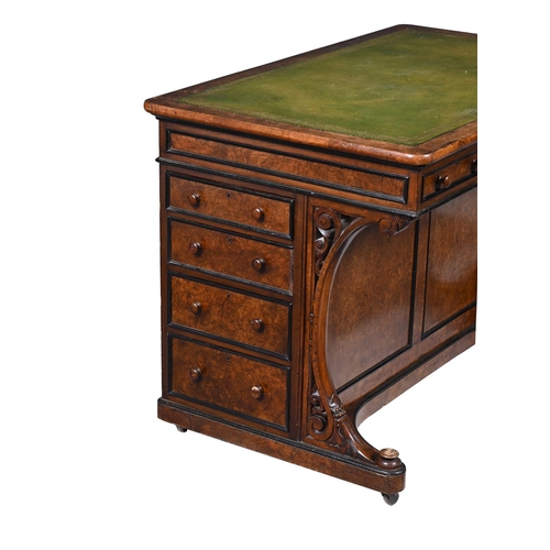 67 - AN AESTHETIC MOVEMENT WALNUT AND EBONSIED WRITING DESK CIRCA 1890With a green leather inset above an... 