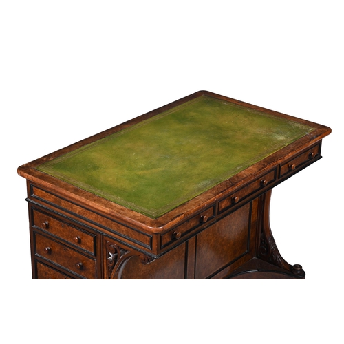 67 - AN AESTHETIC MOVEMENT WALNUT AND EBONSIED WRITING DESK CIRCA 1890With a green leather inset above an... 