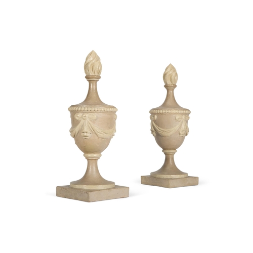 55 - A PAIR OF GREY AND CREAM PAINTED CARVED WOOD FLAMING URNSNORTH EUROPEAN, LATE 18TH/EARLY 19TH CENTUR... 