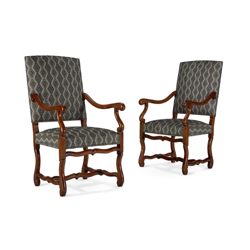 65 - A PAIR OF CHESTNUT OPEN ARMCHAIRSFRENCH, 19TH CENTURY, IN THE 17TH CENTURY STYLE Upholstered in a bl... 