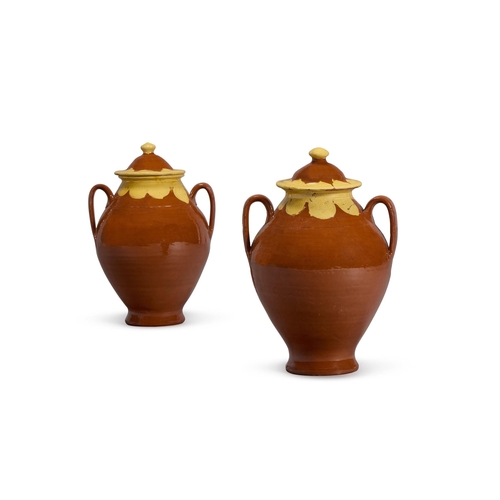 88 - A PAIR OF BROWN-GLAZED POTTERY TWO-HANDLED STORAGE JARS AND COVERSLATE 19TH CENTURY43.5cm high, 28cm... 