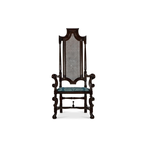 97 - A PAINTED BEECH OPEN ARMCHAIRENGLISH, LATE 17TH CENTURY AND LATERWith a caned back and seat and upho... 