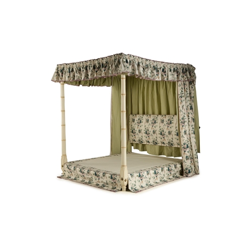 99 - A CREAM PAINTED, SIMULATED BAMBOO FOUR POSTER BEDBY SIBYL COLEFAX & JOHN FOWLERDressed with green 'L... 