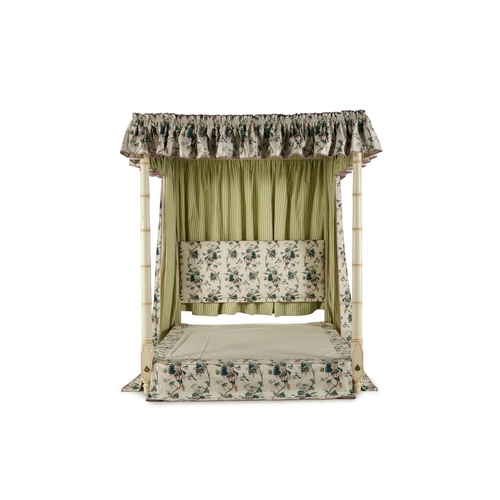 99 - A CREAM PAINTED, SIMULATED BAMBOO FOUR POSTER BEDBY SIBYL COLEFAX & JOHN FOWLERDressed with green 'L... 