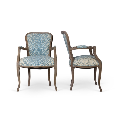 84 - A PAIR OF HARDWOOD OPEN ARMCHAIRSLATE 20TH CENTURY, IN LOUIS XV STYLE Upholstered in Sibyl Colefax &... 