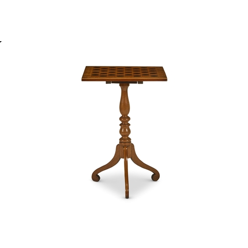 86 - Y AN EBONY, BURR ELM AND MAHOGANY TRIPOD GAMES TABLE ENGLISH, MID 19TH CENTURYThe tilt top inlaid wi... 