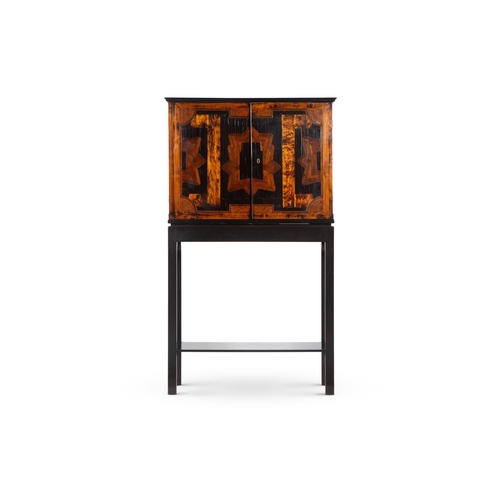 100 - Y AN EBONY, SPECIMEN WOOD AND EBONISED COIN/MEDAL CABINET ON STANDEARLY 19TH CENTURY AND LATEROn an ... 