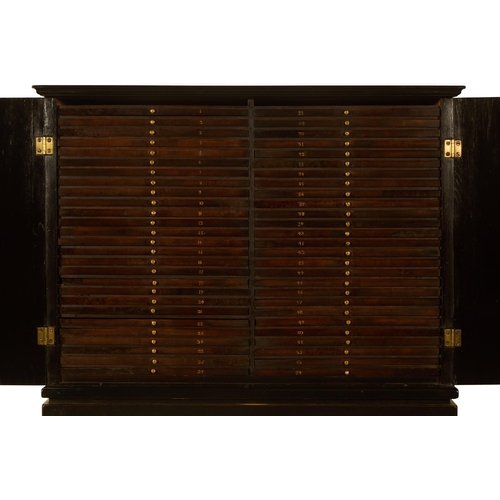 100 - Y AN EBONY, SPECIMEN WOOD AND EBONISED COIN/MEDAL CABINET ON STANDEARLY 19TH CENTURY AND LATEROn an ... 