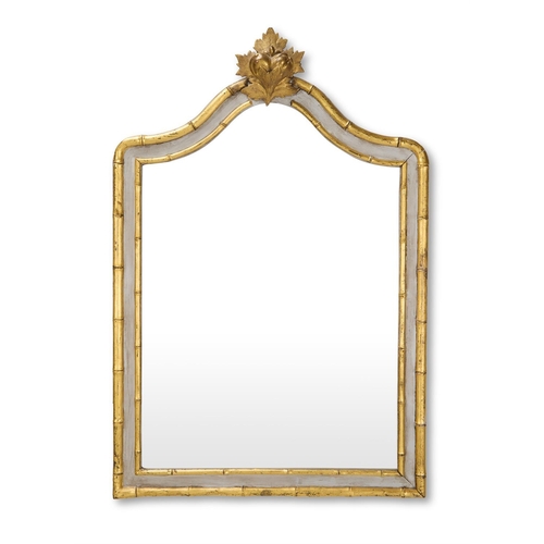 117 - A WHITE PAINTED AND PARCEL GILT SIMULATED BAMBOO MIRROR20TH CENTURYWith arched plate surmounted by a... 