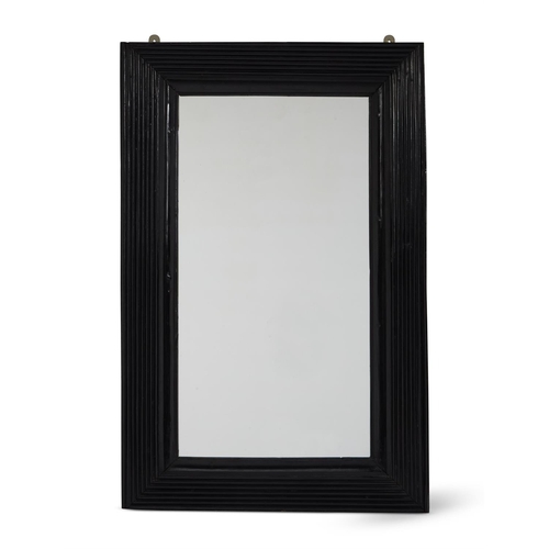 137 - Y AN EBONY MIRROR19TH CENTURYReeded frame, with later plate, reduced in size101cm high, 66cm wide, 5... 