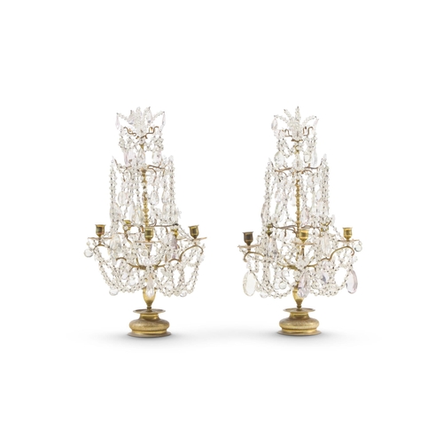 138 - A PAIR OF GLASS FIVE BRANCH CANDELABRALATE 19TH/EARLY 20TH CENTURY  Hung with glass beads70cm high, ... 