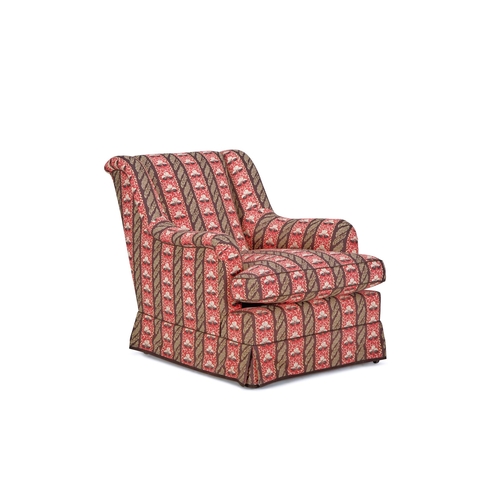 154 - A 'ST JAMES' EASY ARMCHAIRBY SIBYL COLEFAX & JOHN FOWLER Upholstered in Sibyl Colefax & John Fowler ... 